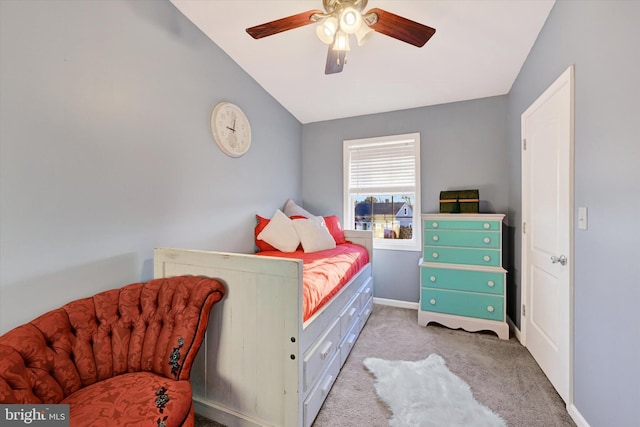 bedroom featuring light carpet, ceiling fan, and lofted ceiling