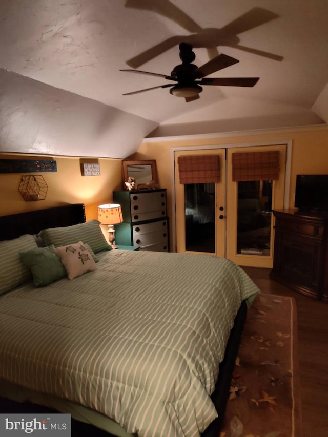 bedroom with hardwood / wood-style flooring, ceiling fan, and vaulted ceiling