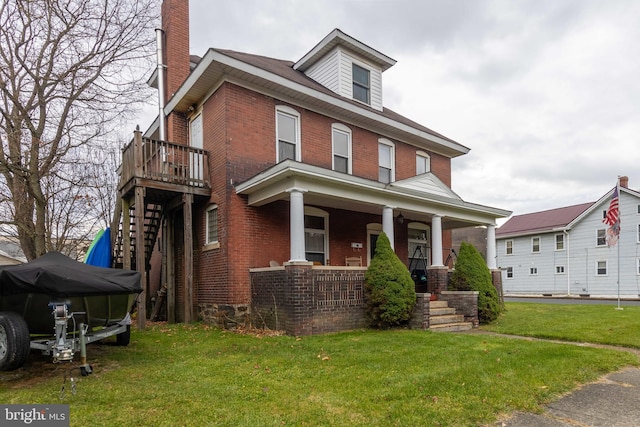 view of front of house with a front lawn and covered porch