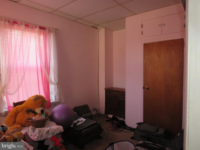 bedroom with a paneled ceiling