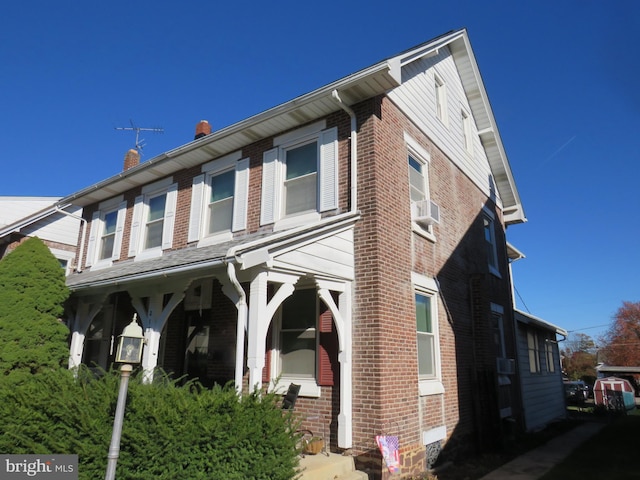 view of home's exterior with cooling unit