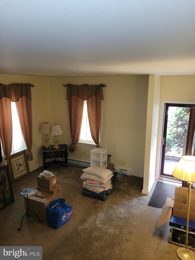 interior space featuring plenty of natural light and baseboard heating