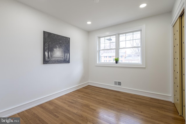 unfurnished bedroom featuring hardwood / wood-style flooring