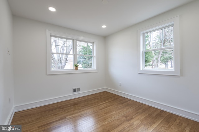 spare room featuring hardwood / wood-style floors