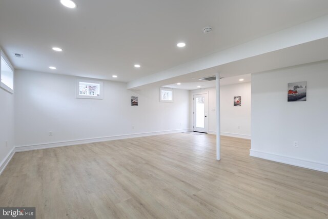 basement featuring light hardwood / wood-style floors