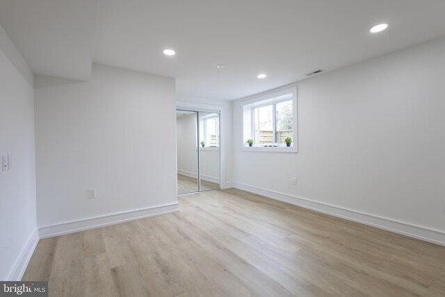 interior space with light hardwood / wood-style floors and a closet