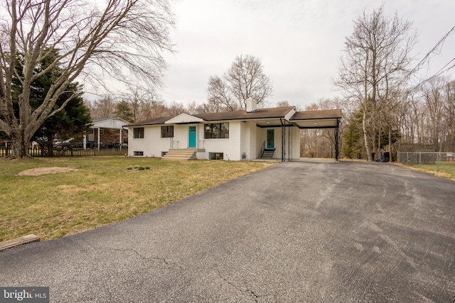 single story home featuring a front yard and a carport