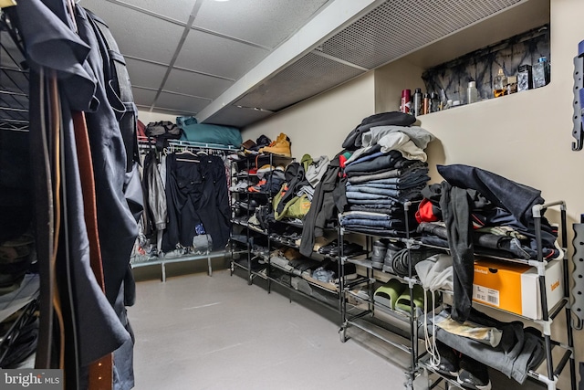 spacious closet with a paneled ceiling