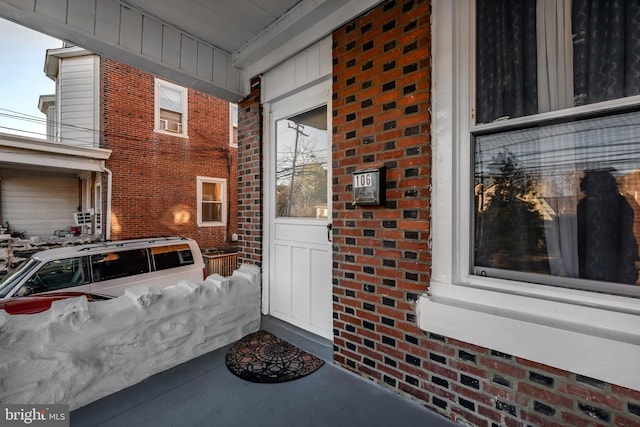 doorway to property featuring covered porch