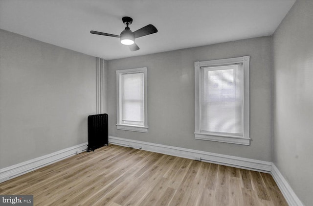 spare room with ceiling fan and light hardwood / wood-style floors