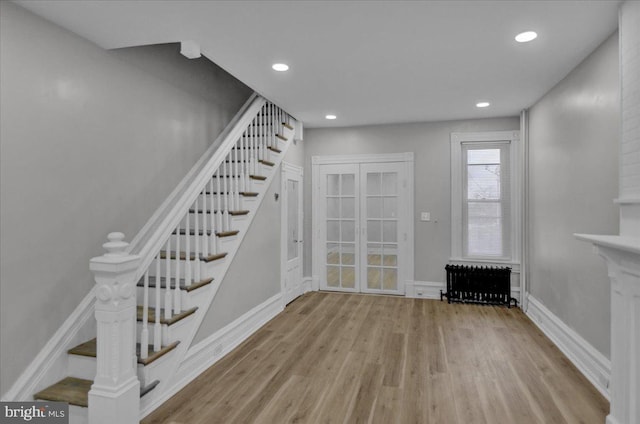 interior space featuring light hardwood / wood-style flooring and radiator