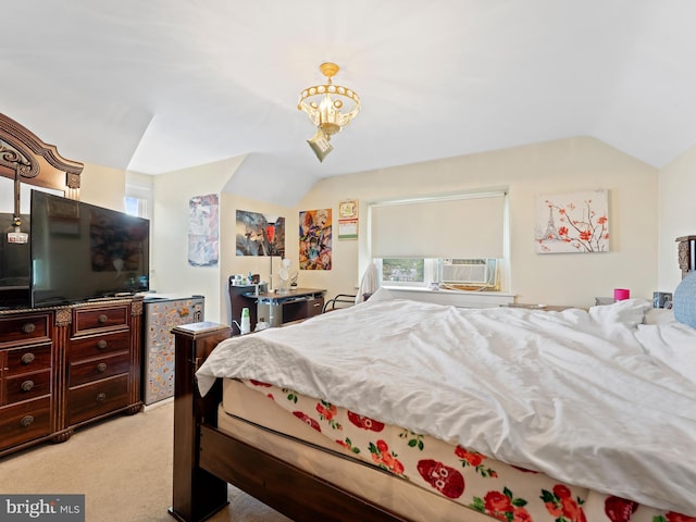 carpeted bedroom with cooling unit, vaulted ceiling, and a notable chandelier