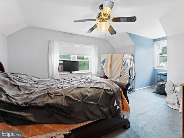 carpeted bedroom with lofted ceiling and ceiling fan