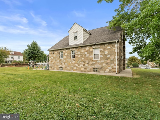 view of home's exterior featuring a patio area and a yard