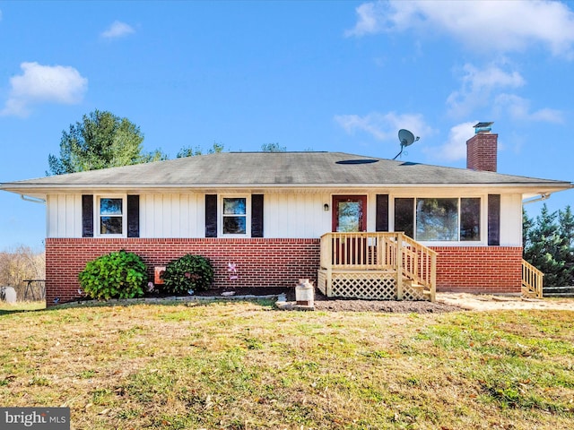 ranch-style home with a front lawn