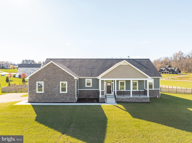 view of front facade with a porch and a front yard