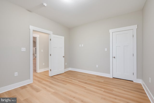 unfurnished room with light hardwood / wood-style floors