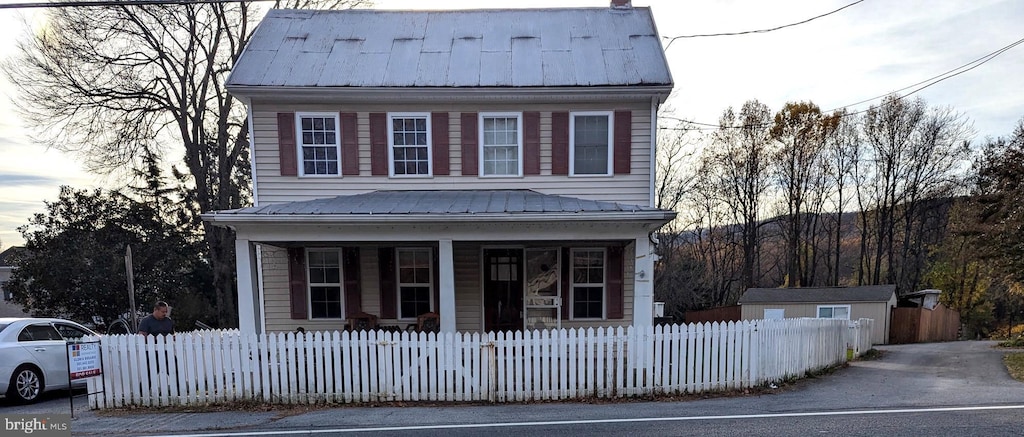 view of front property featuring covered porch