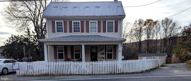 view of front property featuring covered porch