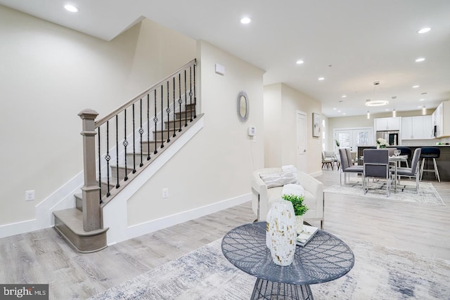 2405 Naylor Rd SE, Washington, DC 20020 - living area featuring light wood-style floors, recessed lighting, baseboards, and stairway