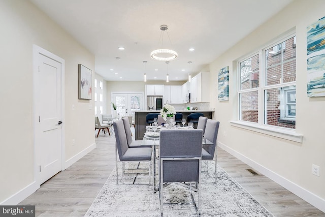 dining space featuring light hardwood / wood-style floors