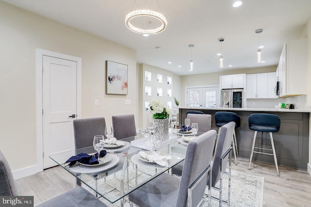 dining room with light hardwood / wood-style flooring