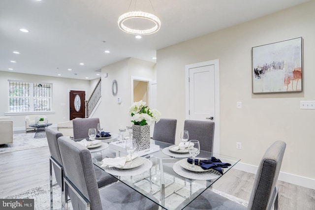 2405 Naylor Rd SE, Washington, DC 20020 - dining area featuring light wood-style floors, a chandelier, stairs, recessed lighting, and baseboards