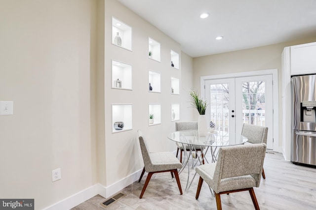 2405 Naylor Rd SE, Washington, DC 20020 - dining room featuring french doors, baseboards, light wood-style flooring, and recessed lighting