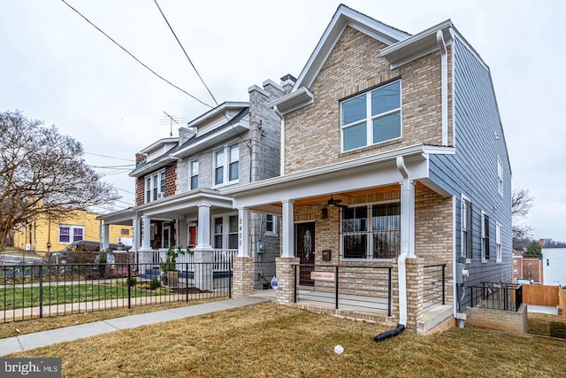 view of front of home with a front yard and a porch