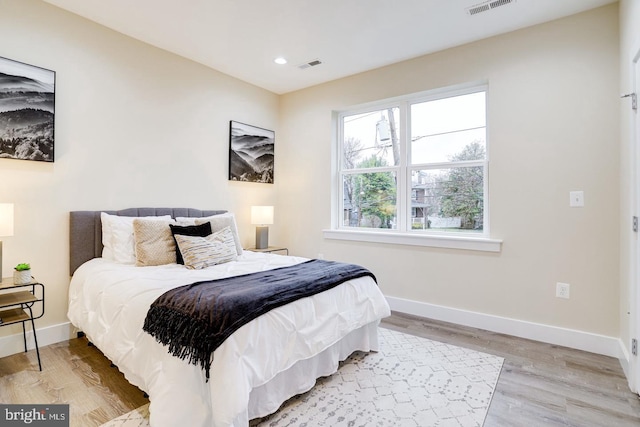 bedroom with light hardwood / wood-style floors