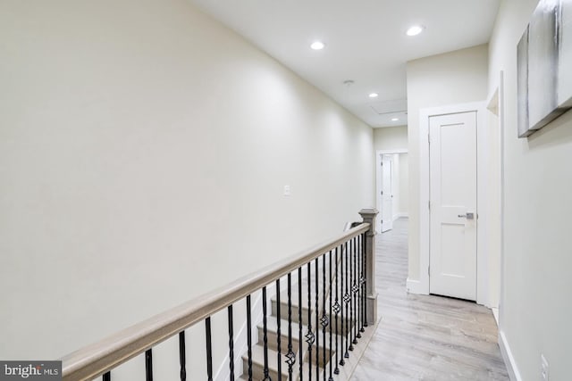 corridor with light hardwood / wood-style flooring