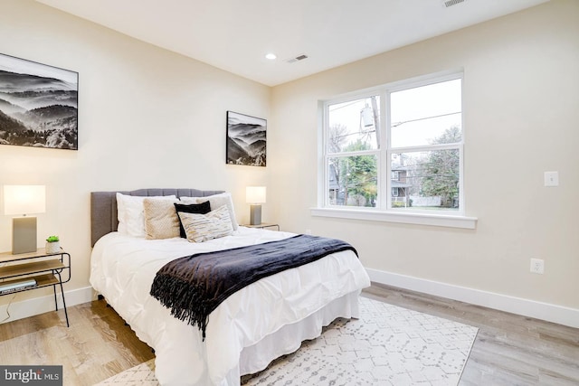 bedroom with light wood-type flooring