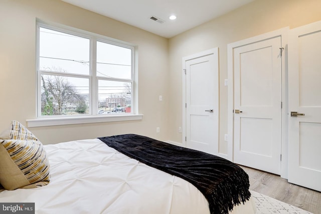 bedroom featuring light hardwood / wood-style floors