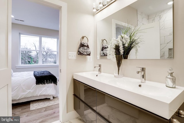 bathroom featuring vanity and hardwood / wood-style flooring