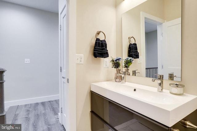 bathroom with wood-type flooring and vanity