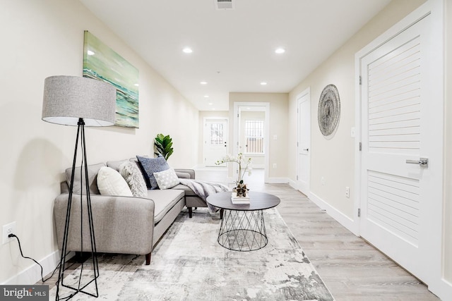 living room with light hardwood / wood-style floors