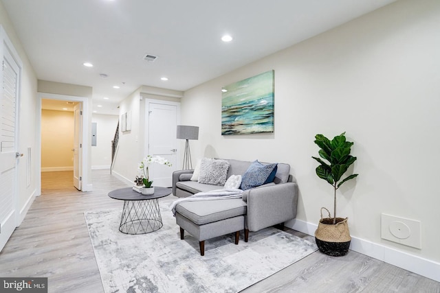 living room with light hardwood / wood-style flooring