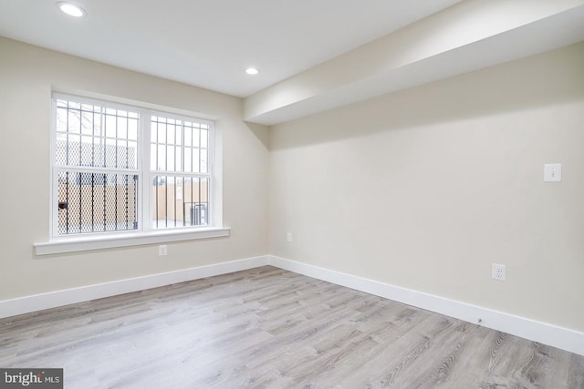 unfurnished room featuring light hardwood / wood-style floors