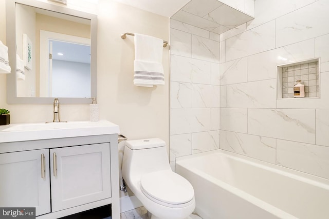 full bathroom featuring vanity, toilet, and tiled shower / bath