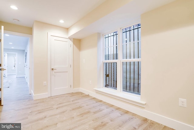 unfurnished room featuring light hardwood / wood-style floors