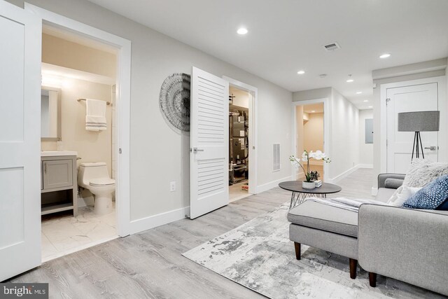 2405 Naylor Rd SE, Washington, DC 20020 - living area featuring recessed lighting, baseboards, light wood-type flooring, and electric panel