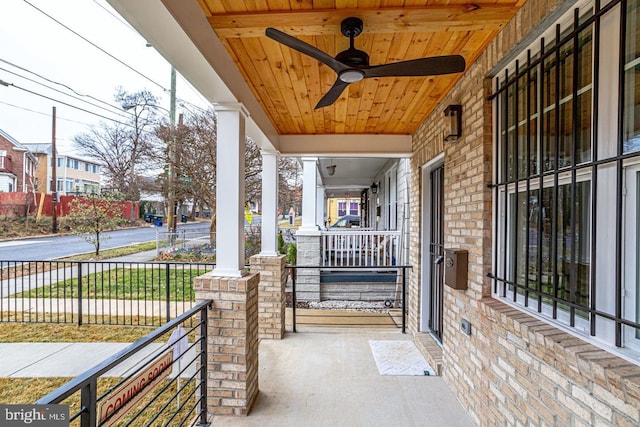 view of patio / terrace with ceiling fan and a porch