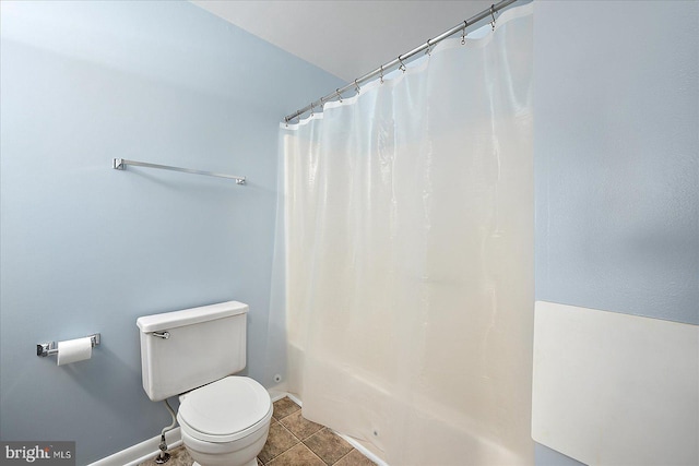 bathroom featuring tile patterned floors and toilet