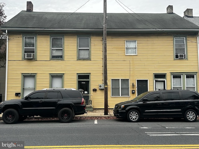 view of front of home featuring cooling unit