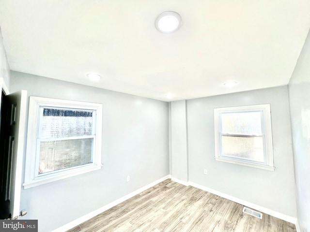 unfurnished room featuring light hardwood / wood-style flooring