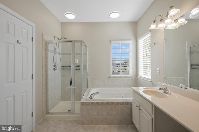 bathroom featuring tile patterned flooring, vanity, and independent shower and bath