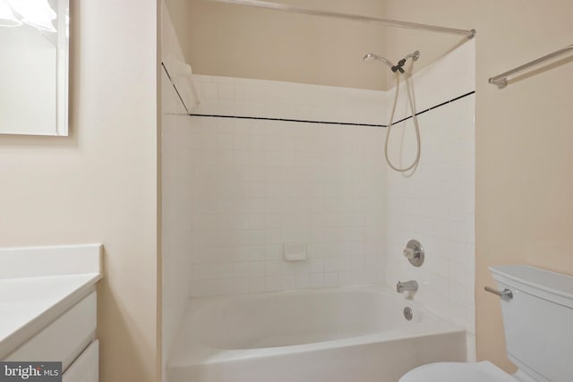 full bathroom with vanity, toilet, and tiled shower / bath combo