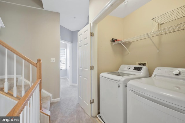 laundry area with light carpet and independent washer and dryer