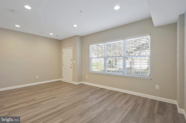 unfurnished room featuring light wood-type flooring