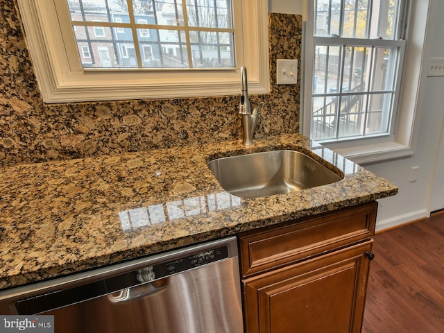 room details featuring dishwasher, dark hardwood / wood-style floors, light stone countertops, and sink